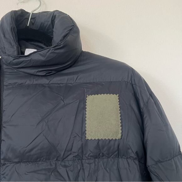 Oiselle Queen Black Asymmetrical Zip Down Puffer Jacket w/ Packable Hood - Picture 4 of 11